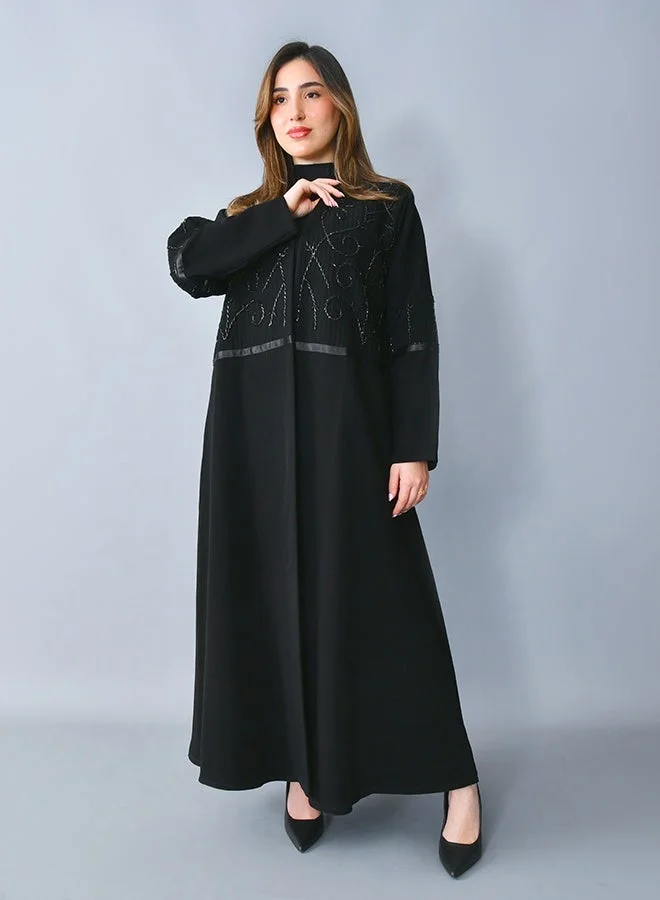 HAWRAA ABAYA Elegant abaya with a fluid semi-flared (half-cloche) silhouette, adorned with delicate beadwork